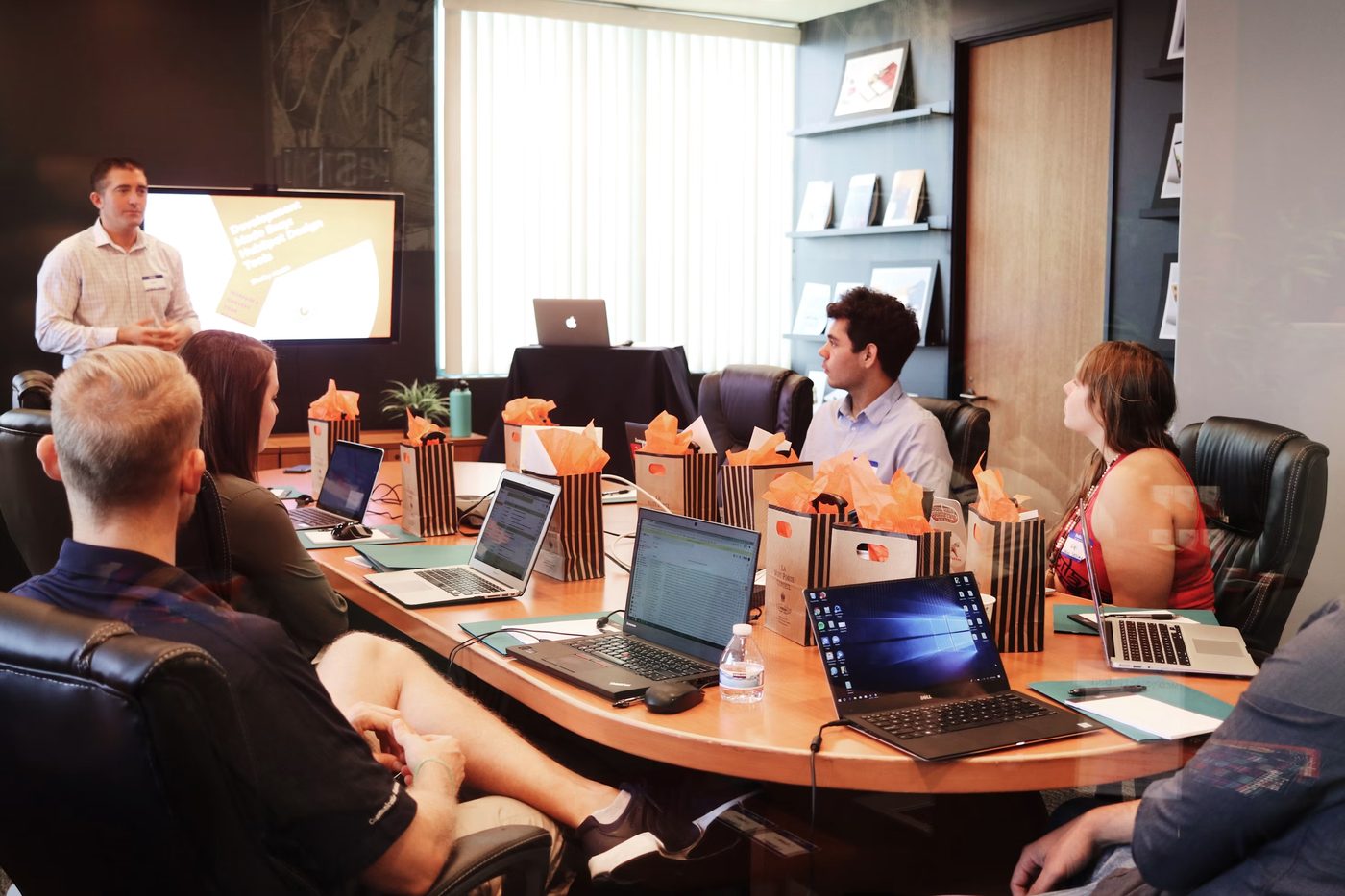 IT consultant presenting strategy to a business team